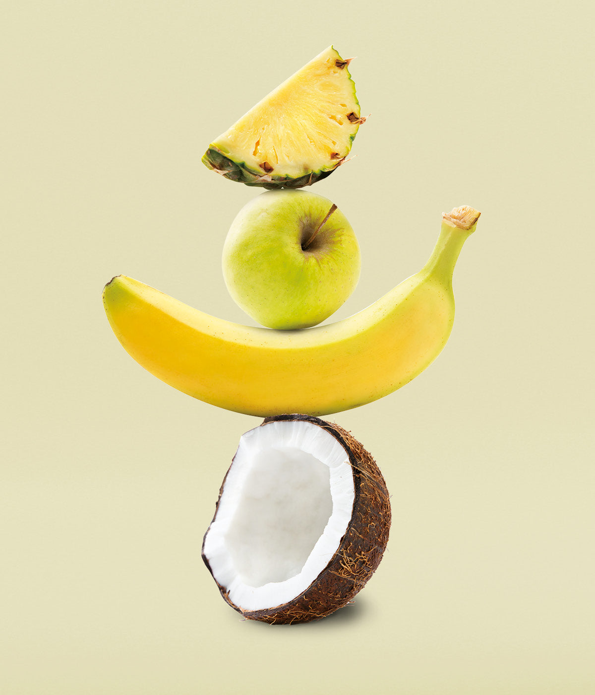 Fruechteturm aus Ananas, Apfel, Banane und Kokosnuss