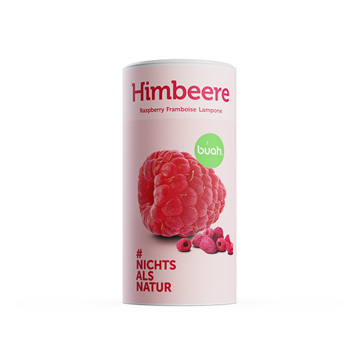 Zwei Dosen buah Himbeeren stehen nebeneinander mit einem kleinen Haufen gefriergetrockneter Himbeeren im Vordergrund